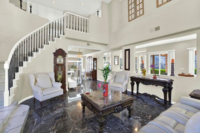 14082 Montfort Ct, San Diego, CA 92128 - living room with stairs, marble tiled flooring, a high ceiling, and baseboards