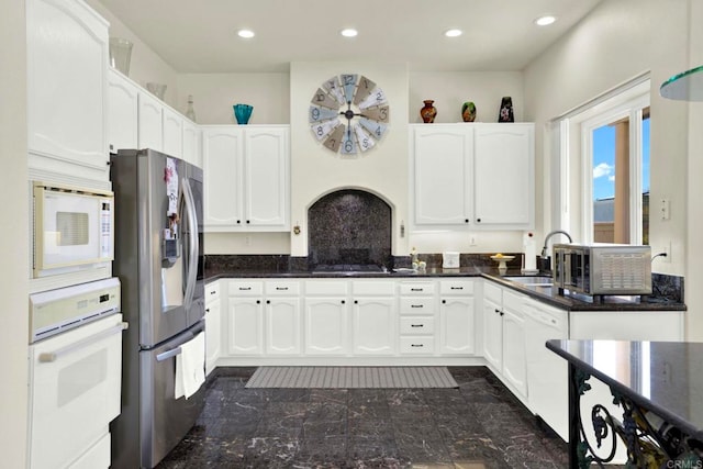 14082 Montfort Ct, San Diego, CA 92128 - kitchen featuring white appliances, a sink, white cabinetry, recessed lighting, and dark stone countertops