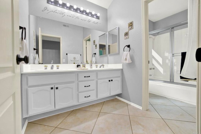 14082 Montfort Ct, San Diego, CA 92128 - full bathroom featuring double vanity, shower / bath combination with glass door, and tile patterned flooring