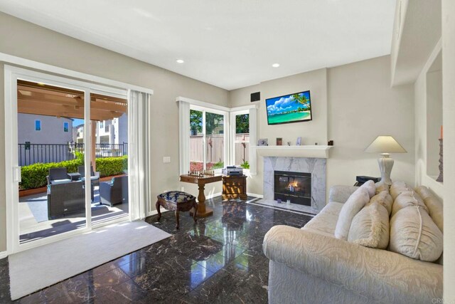 14082 Montfort Ct, San Diego, CA 92128 - living area with granite floors, recessed lighting, and a fireplace