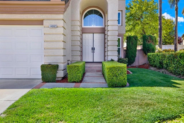 14082 Montfort Ct, San Diego, CA 92128 - property entrance with a yard, stucco siding, and driveway