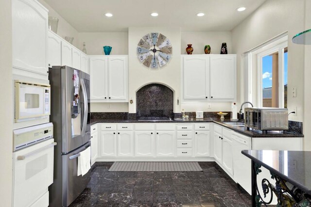 14082 Montfort Ct, San Diego, CA 92128 - kitchen with white appliances, white cabinets, recessed lighting, and dark stone counters
