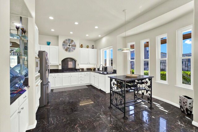 14082 Montfort Ct, San Diego, CA 92128 - kitchen featuring dark marble finish flooring, plenty of natural light, freestanding refrigerator, white cabinets, and recessed lighting