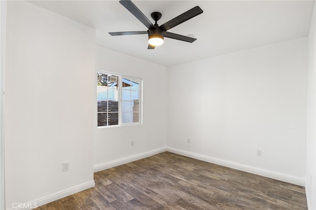 unfurnished room with baseboards, wood finished floors, and ceiling fan