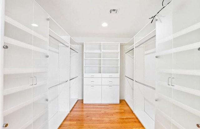 spacious closet with visible vents and light wood-style floors