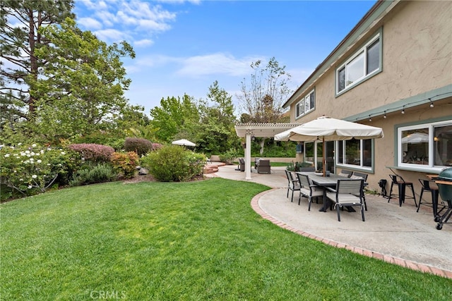 view of yard with a pergola and a patio area