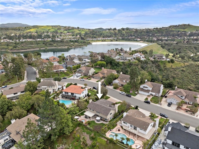bird's eye view with a residential view and a water view