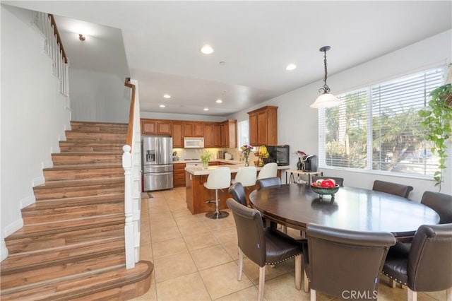 6651 Darling Ln, San Bernardino, CA 92407 - dining area with light tile patterned floors, stairway, and recessed lighting