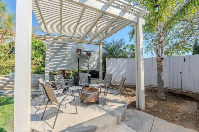 6651 Darling Ln, San Bernardino, CA 92407 - view of patio / terrace featuring a pergola, an outdoor fire pit, and fence