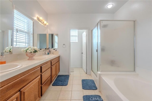 6651 Darling Ln, San Bernardino, CA 92407 - full bathroom with a stall shower, tile patterned flooring, a healthy amount of sunlight, and a sink