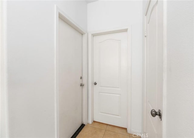 6651 Darling Ln, San Bernardino, CA 92407 - corridor featuring light tile patterned floors