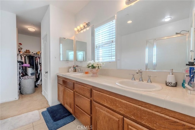 6651 Darling Ln, San Bernardino, CA 92407 - full bath with a stall shower, double vanity, a sink, and a walk in closet