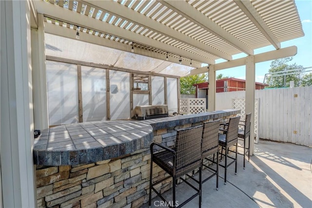 6651 Darling Ln, San Bernardino, CA 92407 - view of patio featuring a pergola, fence, and outdoor dry bar