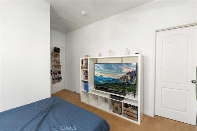 6651 Darling Ln, San Bernardino, CA 92407 - bedroom featuring attic access, baseboards, and carpet