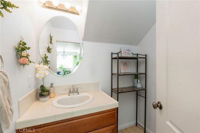 6651 Darling Ln, San Bernardino, CA 92407 - bathroom with vaulted ceiling and vanity