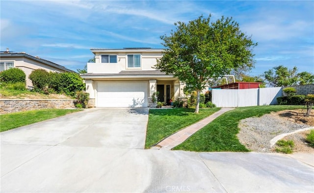 6651 Darling Ln, San Bernardino, CA 92407 - view of front of property with fence, an attached garage, concrete driveway, stucco siding, and a front lawn