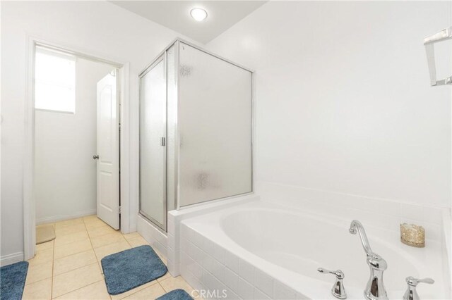 6651 Darling Ln, San Bernardino, CA 92407 - bathroom with a stall shower, tile patterned floors, and a garden tub