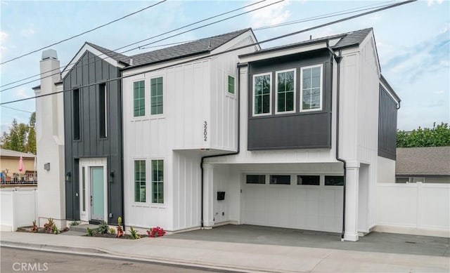 3202 Green Ln, Redondo Beach, CA 90278 - modern inspired farmhouse featuring driveway, fence, a garage, a shingled roof, and board and batten siding