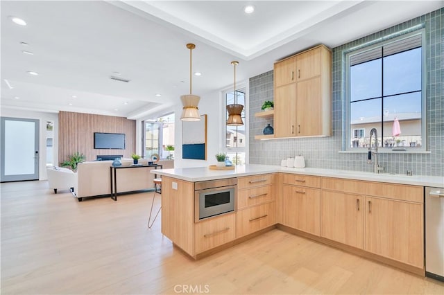 3202 Green Ln, Redondo Beach, CA 90278 - kitchen featuring a peninsula, light wood-style flooring, light brown cabinetry, and a sink