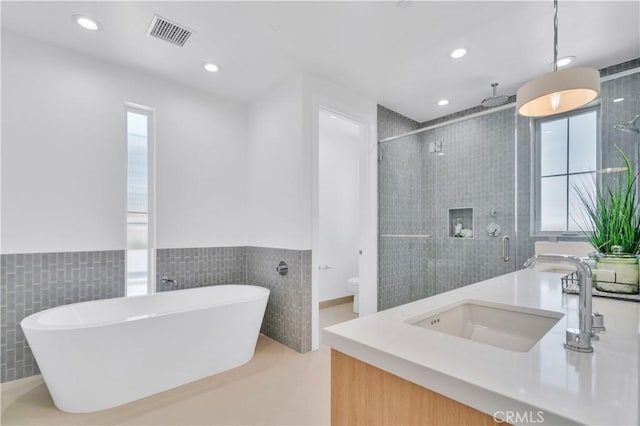 3202 Green Ln, Redondo Beach, CA 90278 - full bath with tile walls, a sink, visible vents, and plenty of natural light