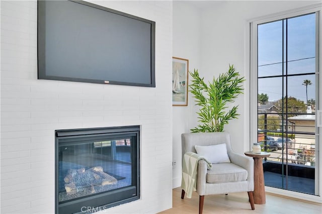 3202 Green Ln, Redondo Beach, CA 90278 - sitting room with light wood finished floors and a fireplace