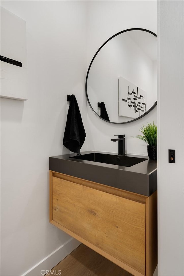 interior space featuring vanity and baseboards
