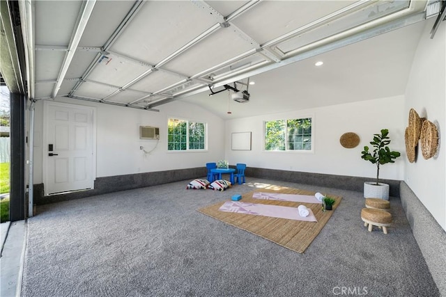 workout area featuring a garage, recessed lighting, vaulted ceiling, and carpet floors