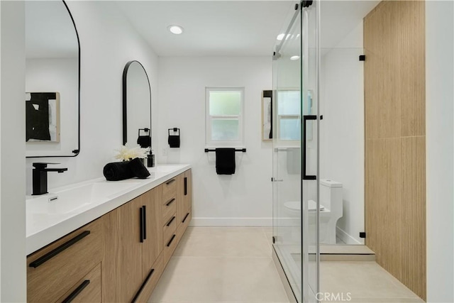 full bath featuring tile patterned flooring, a shower stall, double vanity, toilet, and a sink