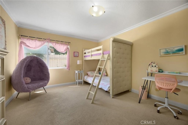 carpeted bedroom with baseboards and ornamental molding