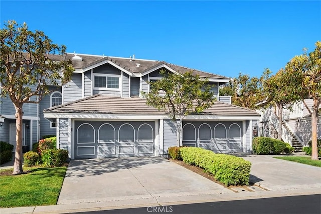 23 Pemberton Pl Unit 121, Laguna Niguel, CA 92677 - view of front of home with a tile roof and concrete driveway