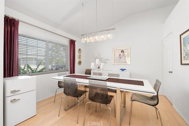 23 Pemberton Pl Unit 121, Laguna Niguel, CA 92677 - dining area with baseboards, vaulted ceiling, and light wood-style flooring