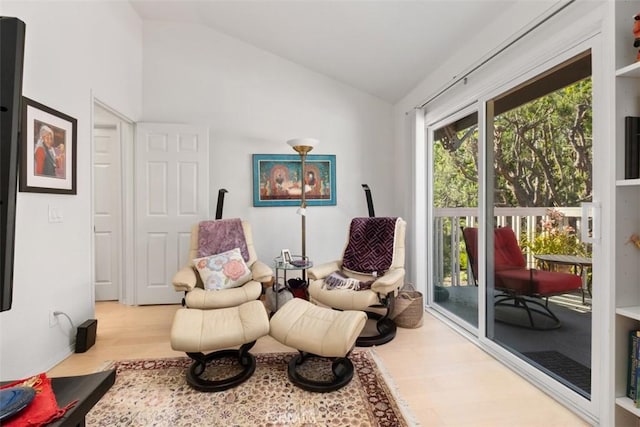 23 Pemberton Pl Unit 121, Laguna Niguel, CA 92677 - living area featuring lofted ceiling and wood finished floors