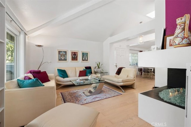 23 Pemberton Pl Unit 121, Laguna Niguel, CA 92677 - living area featuring wood finished floors and lofted ceiling with beams