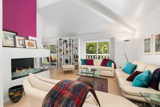23 Pemberton Pl Unit 121, Laguna Niguel, CA 92677 - living room featuring lofted ceiling with beams, wood finished floors, and plenty of natural light