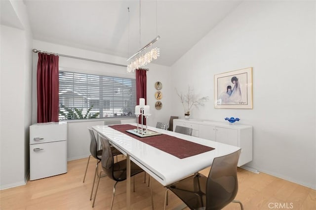 23 Pemberton Pl Unit 121, Laguna Niguel, CA 92677 - dining room featuring lofted ceiling, light wood-type flooring, and baseboards