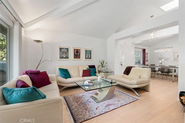 23 Pemberton Pl Unit 121, Laguna Niguel, CA 92677 - living area with vaulted ceiling with beams, wood finished floors, and a chandelier
