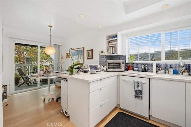 23 Pemberton Pl Unit 121, Laguna Niguel, CA 92677 - kitchen with a toaster, a healthy amount of sunlight, a peninsula, and dishwasher