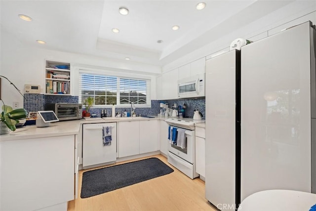 23 Pemberton Pl Unit 121, Laguna Niguel, CA 92677 - kitchen with tasteful backsplash, white appliances, light wood-type flooring, and recessed lighting