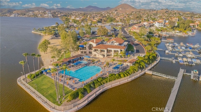 drone / aerial view featuring a water and mountain view