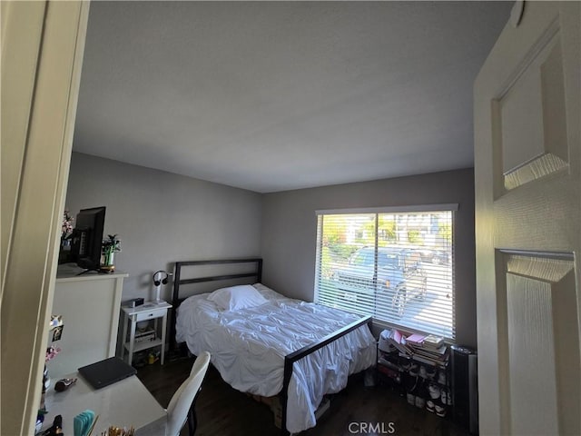 bedroom featuring wood finished floors