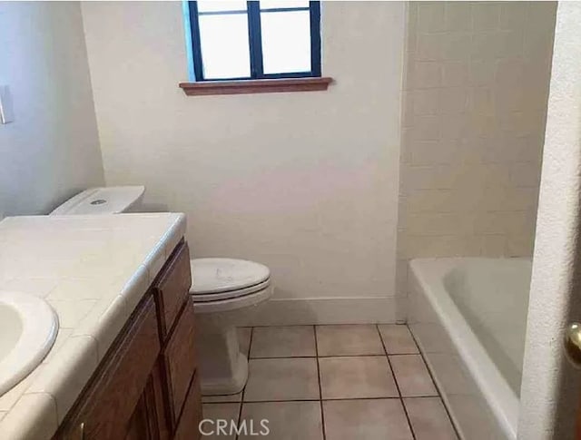 79 Indian Rock Dr, Oroville, CA 95966 - full bath with toilet, tile patterned flooring, vanity, and baseboards