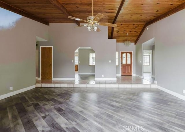 79 Indian Rock Dr, Oroville, CA 95966 - unfurnished living room with wood finished floors, a healthy amount of sunlight, ceiling fan, arched walkways, and wooden ceiling