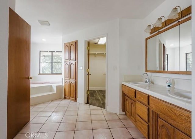 79 Indian Rock Dr, Oroville, CA 95966 - full bath featuring a bath, a sink, tile patterned flooring, double vanity, and a spacious closet