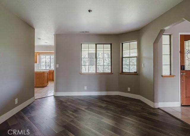 79 Indian Rock Dr, Oroville, CA 95966 - interior space with visible vents, wood finished floors, baseboards, and arched walkways