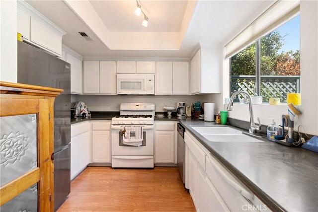 1 Quail Ridge Dr, Atascadero, CA 93422 - kitchen with stainless steel appliances, a sink, a tray ceiling, and white cabinetry