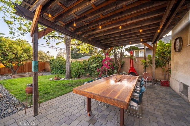 view of patio featuring a fenced backyard and outdoor dining area
