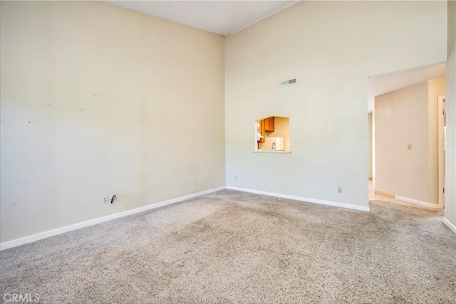 4032 Gray Stone Ct, Kelseyville, CA 95451 - spare room with a high ceiling, baseboards, carpet flooring, and visible vents