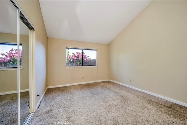 4032 Gray Stone Ct, Kelseyville, CA 95451 - spare room featuring baseboards, lofted ceiling, and carpet