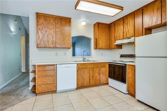 4032 Gray Stone Ct, Kelseyville, CA 95451 - kitchen with a sink, white appliances, brown cabinetry, light countertops, and under cabinet range hood