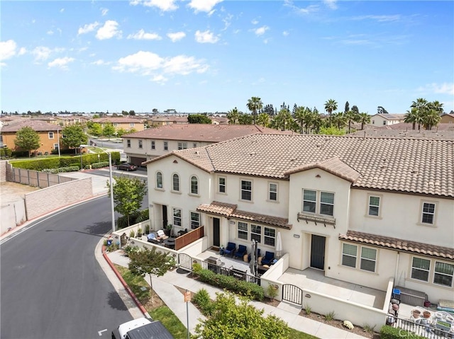 12362 Cottonwood Pl, Santa Fe Springs, CA 90670 - back of property with a fenced backyard, a gate, a residential view, and stucco siding